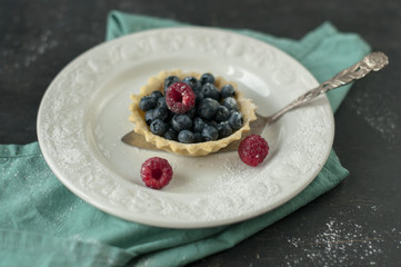 Sand basket with fresh berry.