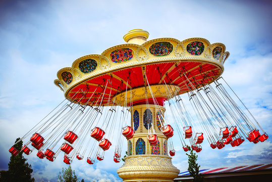 brightly colored carousel at the amusement Park

