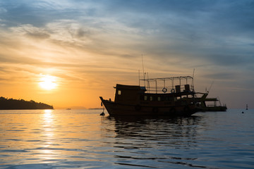 Ferry Boat Silhouette with empty passengers at sunrise.