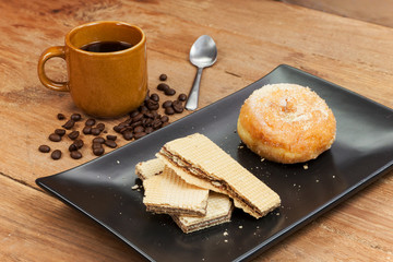 coffee and wafer stick and donuts sugar