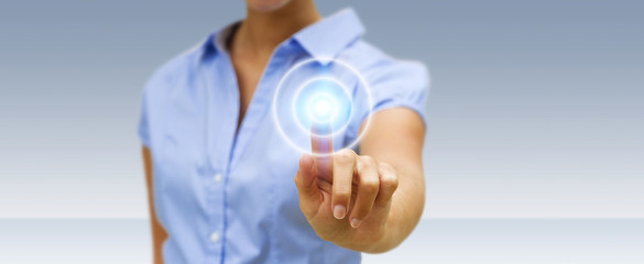 Businesswoman touching modern tactile screen button