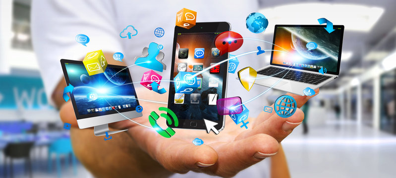 Businessman holding tech devices and icons applications