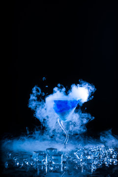 blue cocktail  and ice vapor