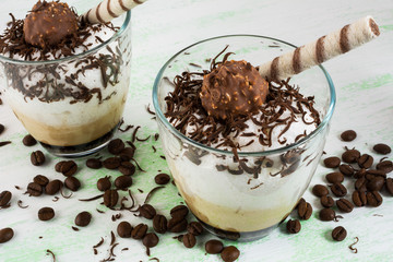 Coffee cocktail with whipped cream on light green background