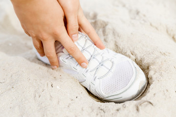 Runner laces his shoes and prepares to jogging