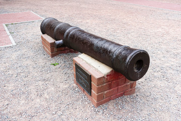Ancient gun on a pedestal