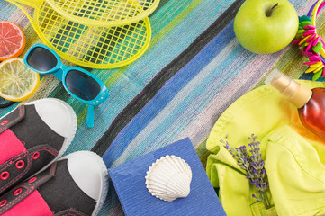 Summer accessories on beach towel