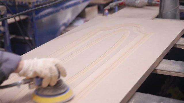 Professional carpenter polish wooden board surface. Close up. 1080p.