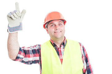 Happy builder pointing finger up