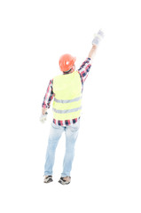 Rear view of male constructor poiting finger
