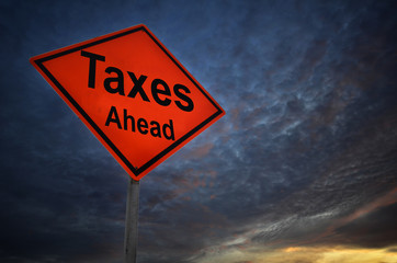 Taxes Ahead warning road sign