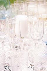 Catering services. Glasses with champagne in row. Background at restaurant party
