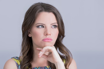 Brunette girl wondering 