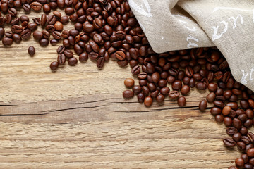 Coffee beans on wooden background