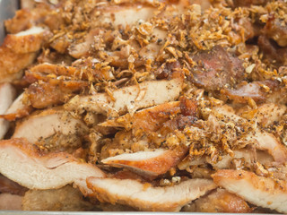Closeup of fried pork with garlic and pepper