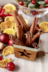 Christmas decorations - cinnamon sticks, dried fruits and balls.