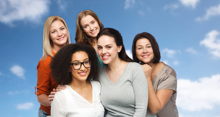 group of happy different women in casual clothes