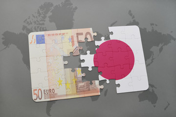 puzzle with the national flag of japan and euro banknote on a world map background.