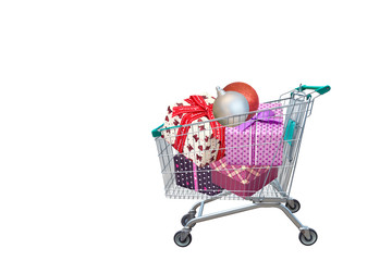 Christmas gifts and presents in shopping trolley on white background.