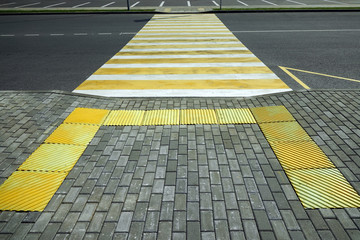 Crosswalk across the street from the ramp for the disabled, the horizontal perspective.