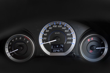 detail with the gauges on the dashboard of a car
