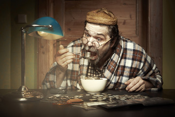 Manian eating portion of coins