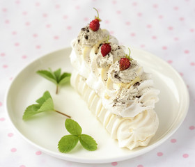 meringue cake with fresh berries on white background