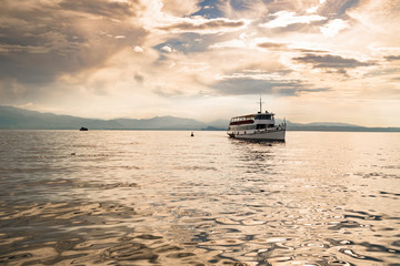 Ferry on Lake Garda at sunset.