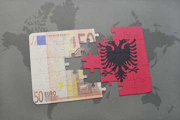 puzzle with the national flag of albania and euro banknote on a world map background.