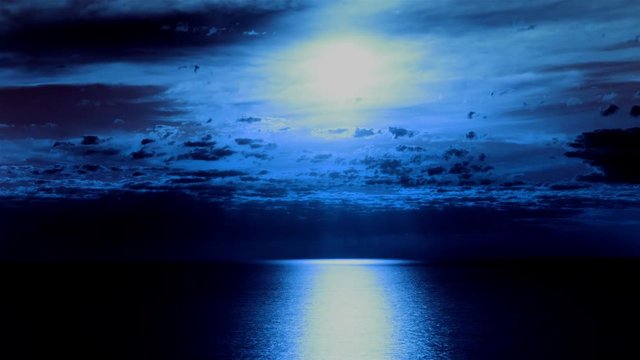 

4k.Moon and clouds  with moon road reflection on sea surface . Timelapse without birds.
