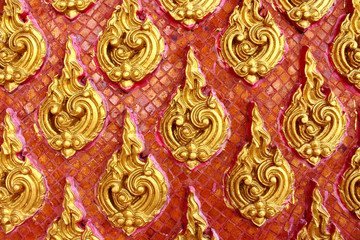 Fototapeta na wymiar Thai style wall pattern in red background