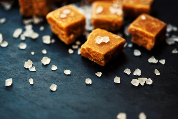 Sweet caramel candies. Salted caramel pieces and sea salt close
