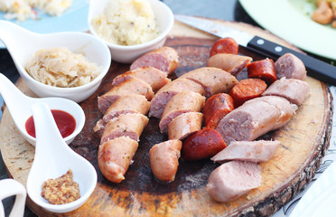 sausage with various of dipping sauce on the plate