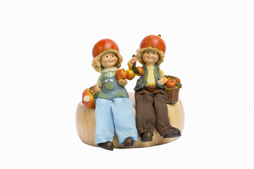 Two little apple boy and girl resin doll on white background