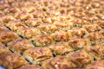 Baklava is a rich, sweet pastry made of layers of filo filled with chopped nuts and sweetened and held together with syrup or honey