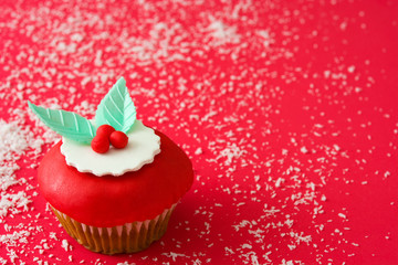 Christmas cupcakes on red background

