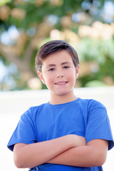 Funny child with ten years old with blue t-shirt