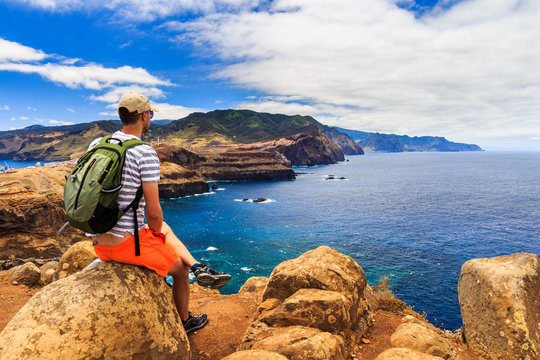 Young male enjoying the view of the cliffs at Ponta de Sao Lourenco, Madeira, Portugal
