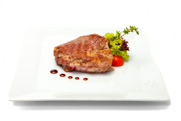Roasted pork neck with lettuce and cherry tomatoes