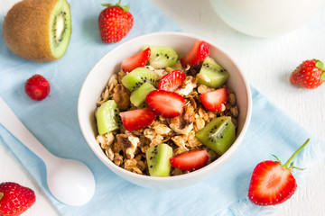 Homemade granola with strawberry and kiwi