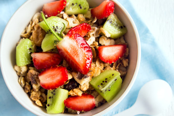 Homemade granola with strawberry and kiwi