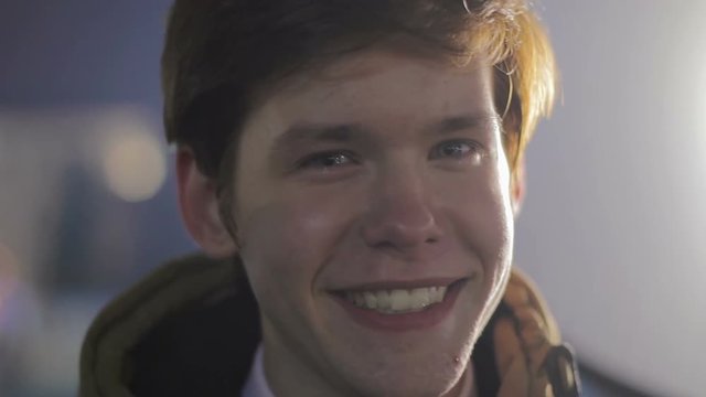 Funny smiling man looking at camera and pulling faces, happiness, youthfulness