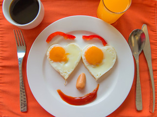 Happy Face Frying Eggs with coffee for breakfast