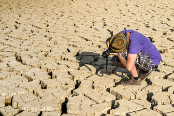 Young photographer in a desert
