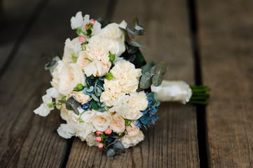 bridal bouquet on wooden background