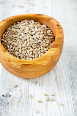 sunflower seeds in a wooden bowl