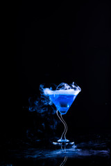 blue cocktail with splash and ice vapor