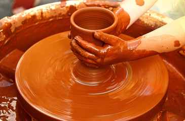 Working on a potter's wheel