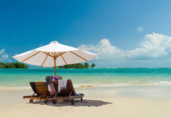 Couple on the beach at tropical resort