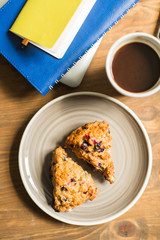 concept: workplace , computer, notebooks, home-made cakes